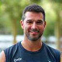 Ritratto professionale del Coach Marco Bianchi, istruttore fitness